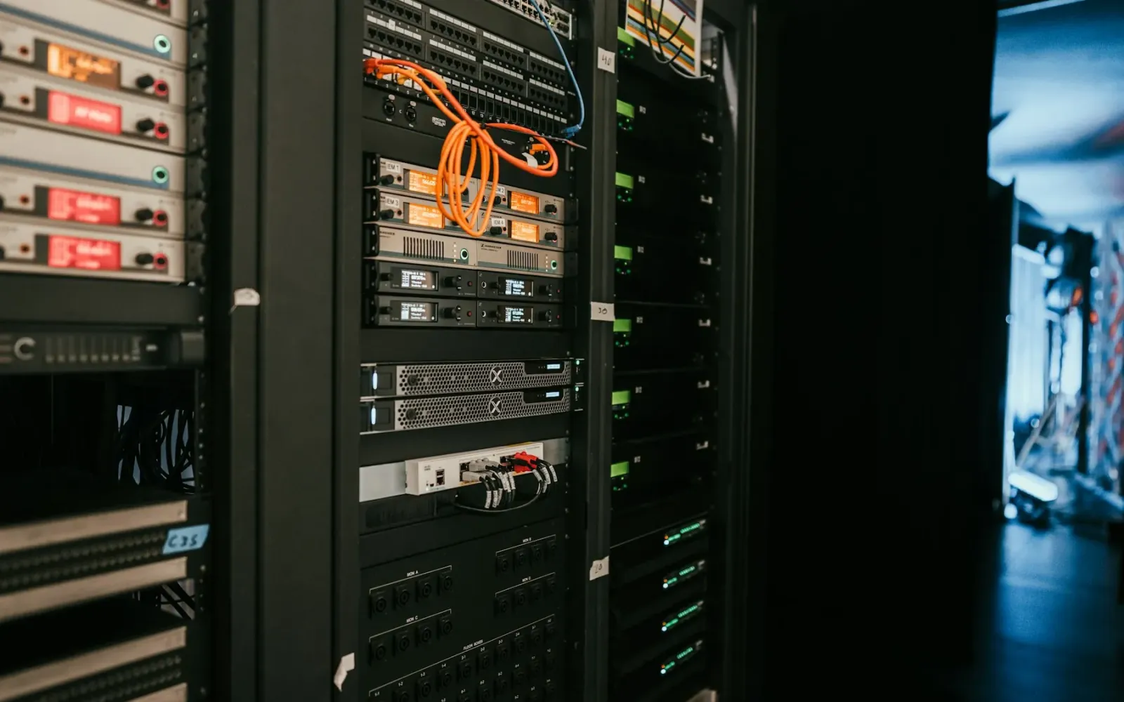 A rack of servers with cabling in a server room